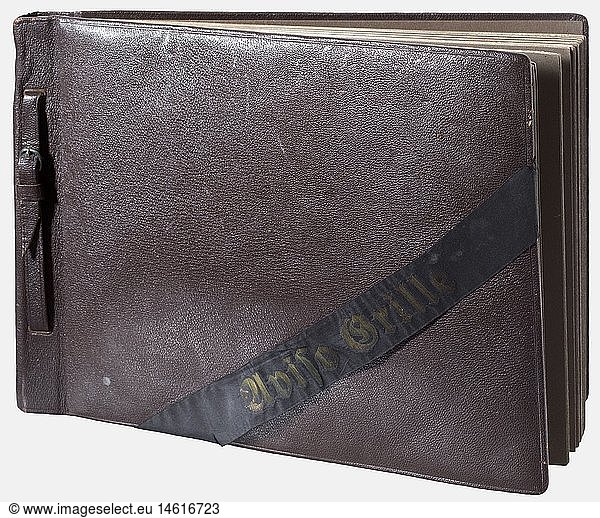 DRITTES REICH ZEITGESCHICHTE  Adolf Hitler  Album mit 51 Aufnahmen von seiner Yacht 'Aviso Grille' Die Aufnahmen im Format 8 x 11 cm  eingeklebt  vermutlich anlÃ¤sslich eines FlottenmanÃ¶vers aufgenommen: Hitler am Flugplatz bzw. an Bord mit Raeder  GÃ¶ring und von Blomberg  Ã¼ber Deck brechende Welle  Hitler mit der Crew  Detailaufnahmen anderer Schiffe  angetretene Crewmitglieder mit Ã„rmelabzeichen in Form des FÃ¼hrerstanders  Hitler mit Offizieren und Besatzungen  feuernde BordgeschÃ¼tze  U-Boote im Hafen  Hitler auf dem Turm bzw. beim Klettern in und aus der Luke eines U-Bootes u.v.m. Brauner Ledereinband mit vs. MÃ¼tzenband 'Aviso Grille'. In der Einbanddecke beschriftet 'Property of Lt. Daniel DeNicola... captured from Hitler's Home in Munich  Germany'. Dabei einige US-Zeitungsausschnitte mit Berichten Ã¼ber Lt. DeNicola und dieses Album. Hochinteressantes Album mit seltenen Aufnahmen  hÃ¶chstwahrscheinlich ein Geschenk der Besatzung der 'Aviso Grille' an Hitler
