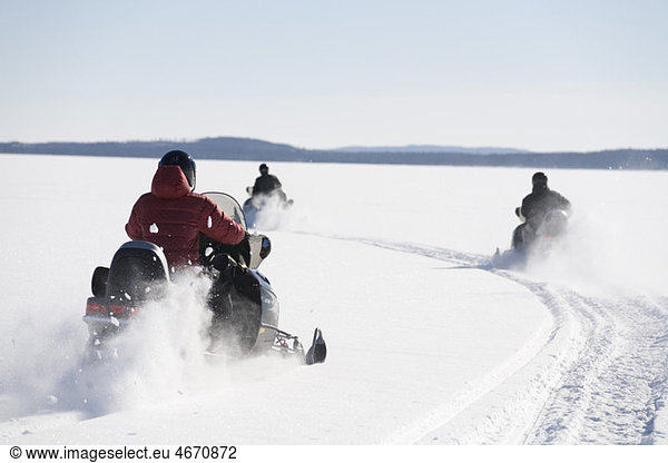 Driving snowmobile on ice