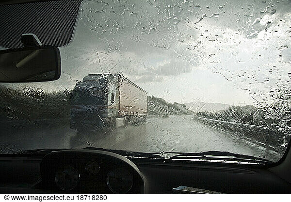 Driving through a rainstorm on a highway through Extremadura  Spain.