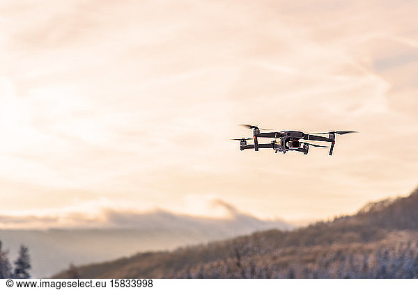 drone flying at dusk in sunset.