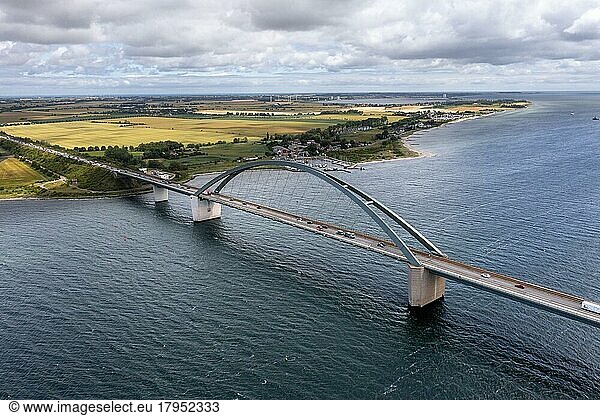 Drone photo  drone shot  Fehmarnsund bridge over the Baltic Sea  truck and car traffic  looking over the coast  sandy beach and harbour  Fehmarn island  Schleswig-Holstein  Germany  Europe