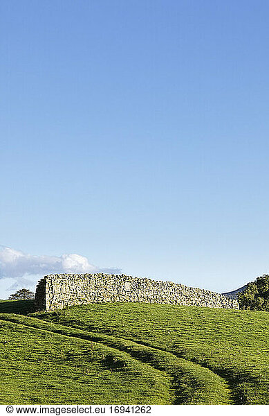 Dry stone wall in rural landscape.