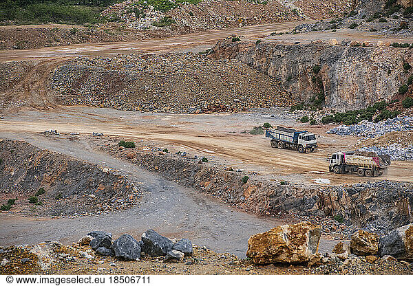 dumb trucks working at gravel mine in Thailand