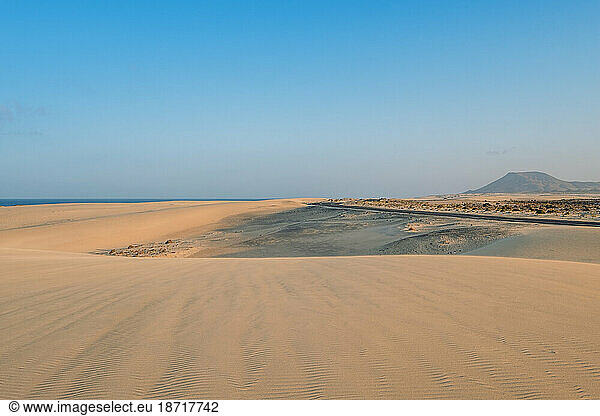 Dunes of Corralejo Natural Park with road landscape in Fuerteventura