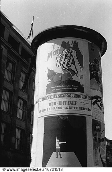 East Berlin / East Germany (GDR). Advertising column with FDGB (Free German Union) propaganda poster on 1st May. Photo  1957.