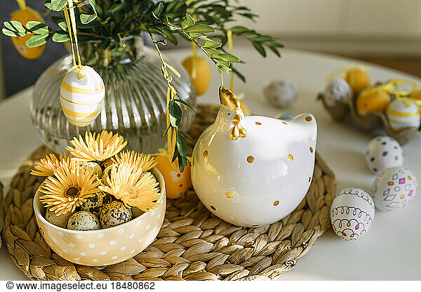 Easter eggs and decoration on table at home