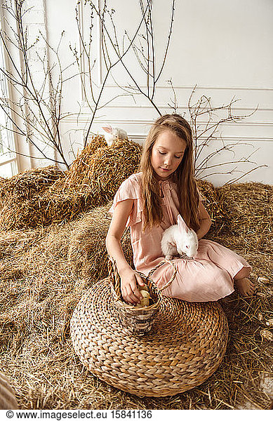 Easter kids playing with rabbits and ducks