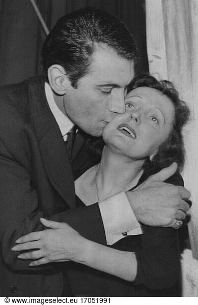 Edith Piaf (born Edith Giovanna Gassion)  French singer.
December 19  1915 Paris / Belleville – October 11  1963 Grasse.
Piaf’s lover  the singer Félix Marten embraces and kisses his “teacher Edith after the dress rehearsal in the Cyrano in Versailles on 6 February 1958. Photo.