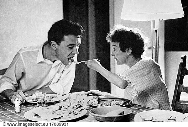 Edith Piaf  real name Giovanna Gassion;
French Chanson singer  19.12.1915 Belleville – 11.10.1963 Paris. Edith Piaf and her lover  the American painter Douglas Davis  sharing a meal in “Le Hallier   her manager Loulou (Louis) Barrier's country estate west of Paris. Photo  summer 1959.