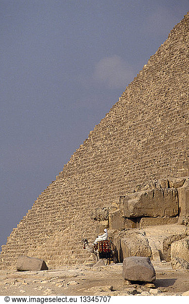EGYPT Cairo Chephren (Khafre) Pyramid with man on camel at the base