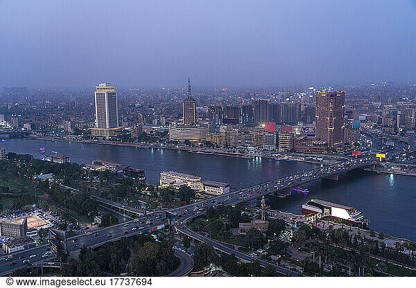 Egypt  Cairo  River Nile  Qasr El Nil Bridge and surrounding downtown buildings at dusk