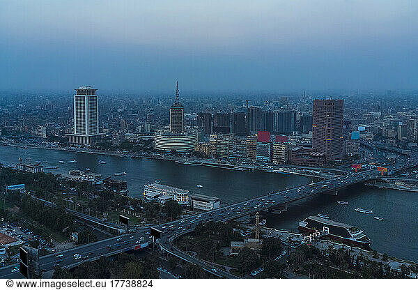 Egypt  Cairo  River Nile  Qasr El Nil Bridge and surrounding downtown buildings at dusk