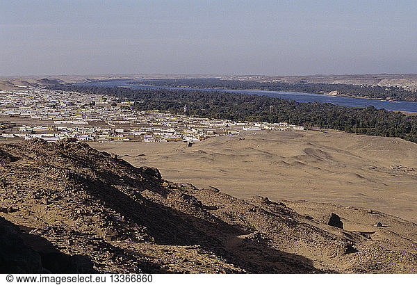 EGYPT Nile Valley Near Aswan View form hillside over Nubian village on the bank of the Nile
