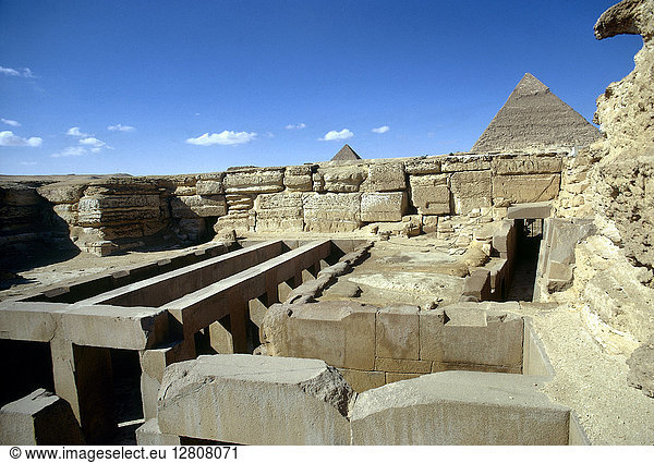 EGYPT: VALLEY TEMPLE. A view of the valley temple of Khephren in Giza Egypt with the pyramids of Khefren (right) and Mykerinos seen in the distance. Photographed c1970.