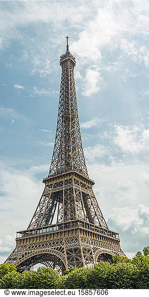 Eiffel tower on the blue sky with clouds in Paris  France.