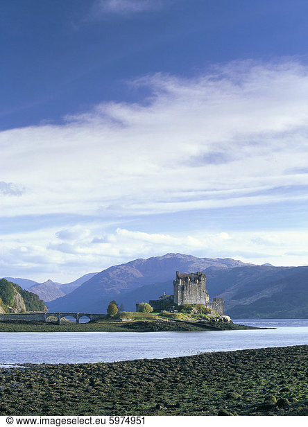 Eilean Donan castle at low tide  MacRae stronghold on small island in Loch Duich  built in 13th century to ward off the Vikings  Dornie  Highland region  Scotland  United Kingdom  Europe