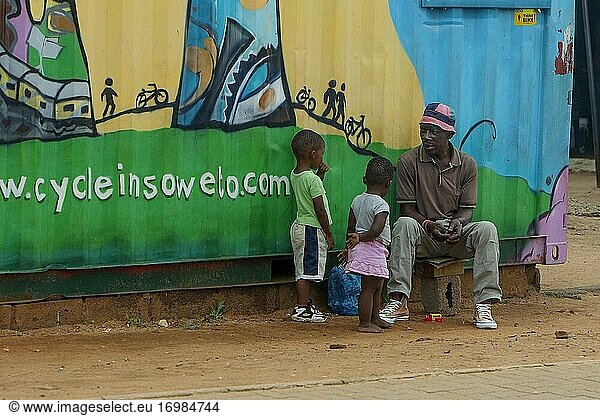 Elderly African man and two children in Soweto township  Johannesburg  South Africa