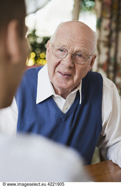 Elderly man in discussion