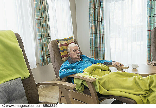 Elderly man sleeping in rest home