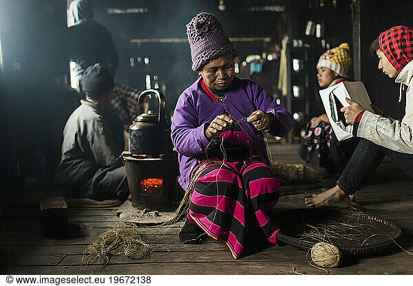 Elderly woman knitting indoors  Myanmar  Shan  Myanmar