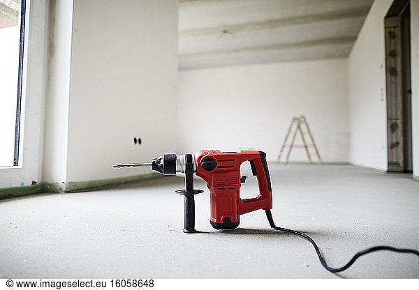 Electric drill on construction site