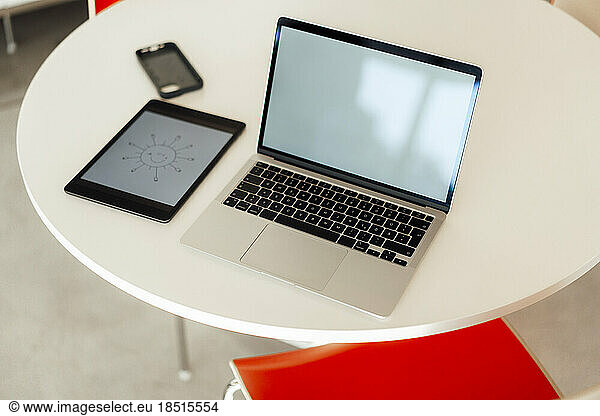 Electric gadgets on table in office
