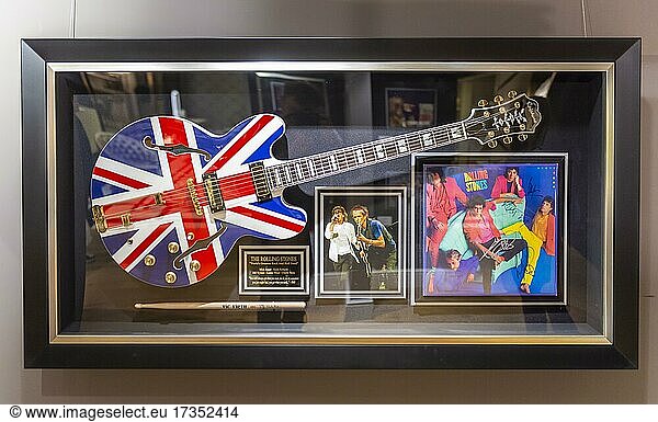 Electric guitar with Great Britain flag of the Rolling Stones  siginated album of the Rolling Stones in a display window  luxury department stores  Harrods  London  England  Great Britain