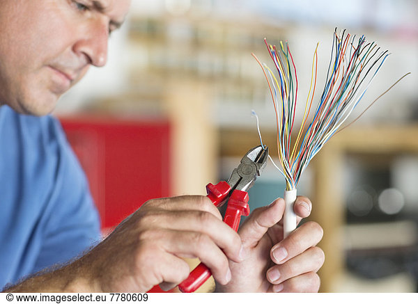 Electrician trimming wires