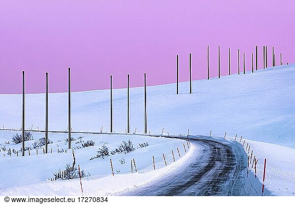 Electricity pylons in winter landscape  Tana  Norway  Europe