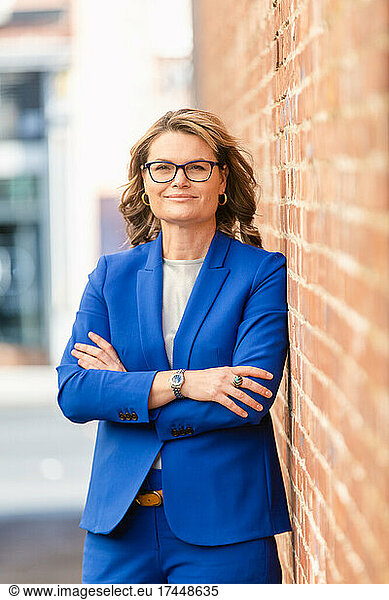 Elegant business lady in suit and glasses