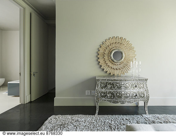 Elegant dresser and mirror in luxury bedroom