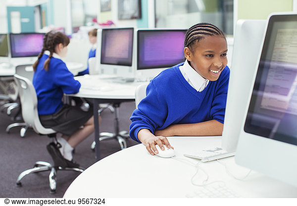 Elementary school children working with computers during IT lesson