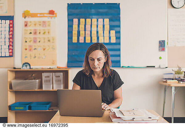 Elementary school teacher working on her laptop.