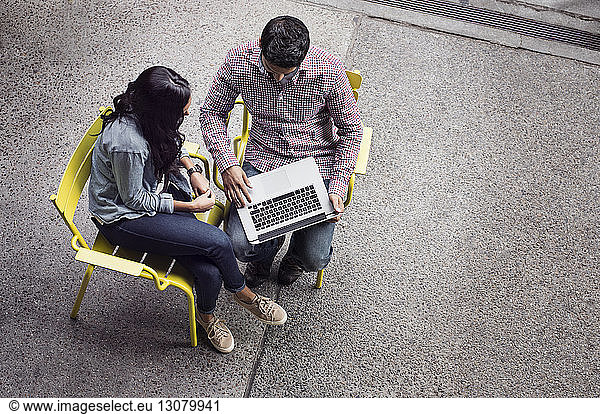 Elevated view of couple using laptop