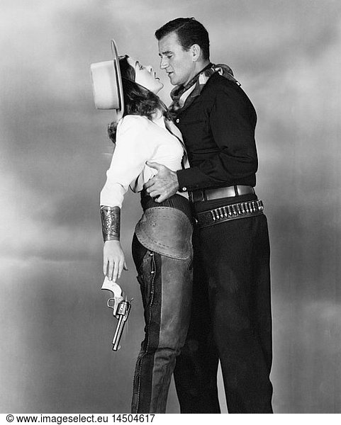 Ella Raines  John Wayne  on-set of the Film Tall in the Saddle  1944