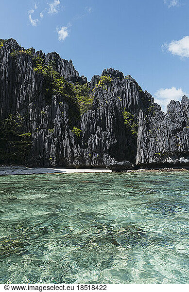 Empty beach with crystal clear water in El Nido