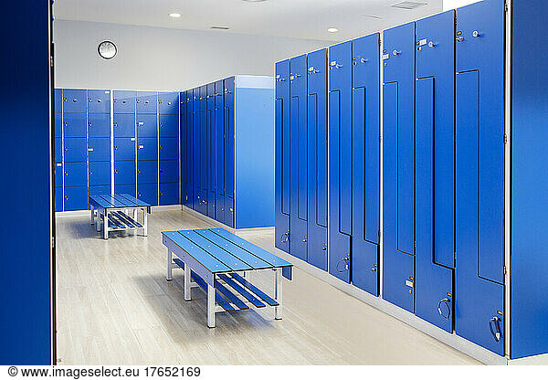 Empty blue locker room at gym