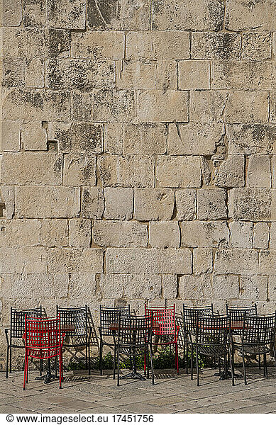 empty chairs at outdoor cafe in Split