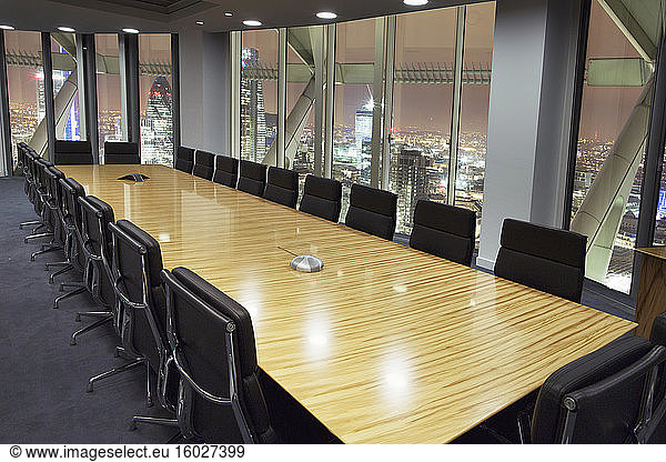 Empty conference room overlooking London at night  London  United Kingdom