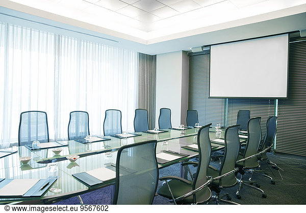 Empty conference room with modern glass table