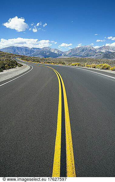 Empty road  Highway 120  curving around corner  near Mono Lakes.