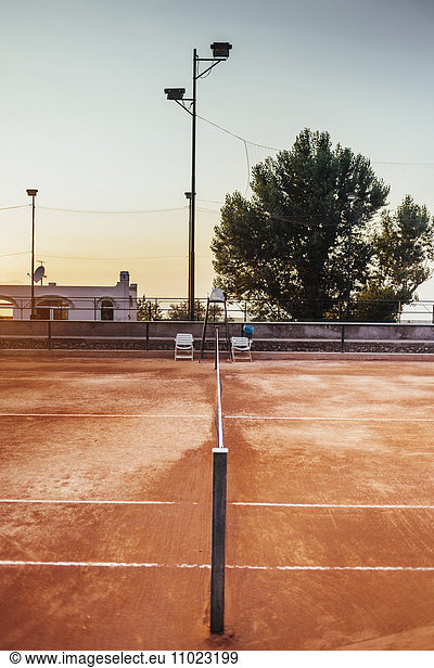 Empty tennis court against clear sky