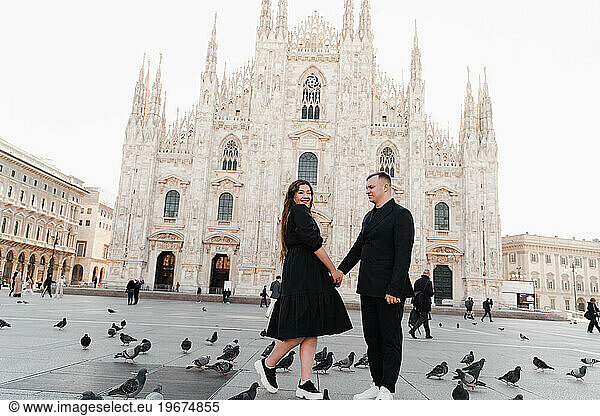 Enamored young man and woman on the background of the Duomo
