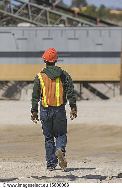 Engineer walking at a gravel and asphalt plant
