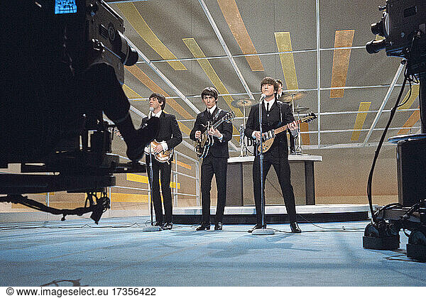English Rock Band The Beatles  from left Paul McCartney  George Harrison  John Lennon  Ringo Starr performing on the Television Variety Series  The Ed Sullivan Show   New York City  New York  USA  Bernard Gotfryd  February 1964