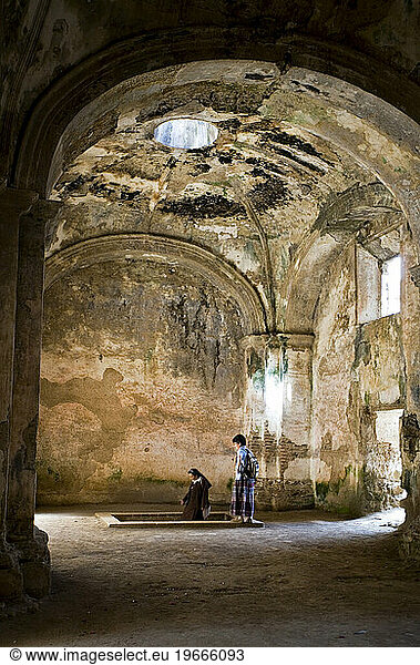 Entering a catacomb  the ruins of the old church Santa Clara  Antigua  Guatemala