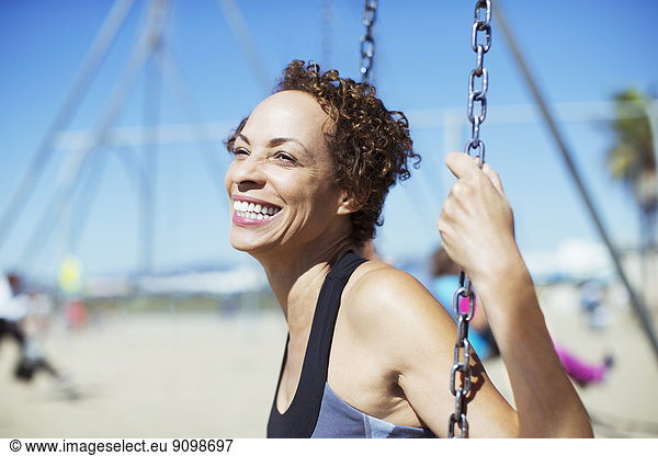Enthusiastic woman swinging