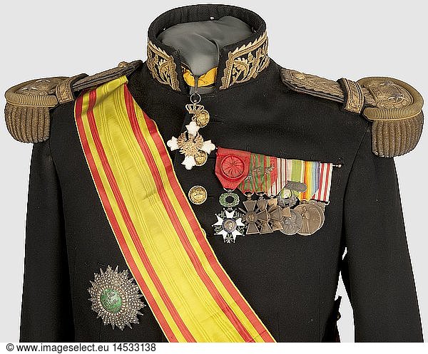 ENTRE-DEUX-GUERRES  Tunique modÃ¨le 1930 de gÃ©nÃ©ral de brigade  avec ses Ã©paulettes du modÃ¨le 1872-92 et un ensemble de dÃ©corations comprenant une Grand-Croix du Nicham Iftikar (ruban avec son insigne et plaque de Grand-Croix avec monogramme du Bey de Tunis)  une Croix de Commandeur de l'Ordre Royal du PhÃ©nix (GrÃ¨ce) et une barrette de dÃ©corations (Officier LH  Croix de Guerre 1914-18 avec Ã©toiles de citation  Valeur Militaire avec palme  Croix du Combattant  MÃ©daille de la Campagne du Maroc  MÃ©daille CommÃ©morative 1914-18 et InteralliÃ©e)  ~ A 1930 Pattern Tunic for a Brigadier General  with 1872/92 Pattern Shoulder Boards  and a Set of Decorations. Grand Cross of Nicham Iftikar (jewel  ribbon and plaque for Grand Cross with the Bey of Tunis monogram)  Commander's Cross of the Order of the Phoenix (Greece) and ribbon bar (Officier de la LÃ©gion d'Honneur  Croix de Guerre 14-18 with stars  Valeur militaire with palm  Croix du Combattant  mÃ©daille de la campagne du Maroc  14-18 commemorative medal and Interallied medal)  historic  historical  object  objects  stills  clipping  clippings  cut out  cut-out  cut-outs  medal  decoration  medals  decorations  award  awards  honouring  badge of honour  badge of honor  badges of honour  badges of honor  noble  precious  1930s  20th century