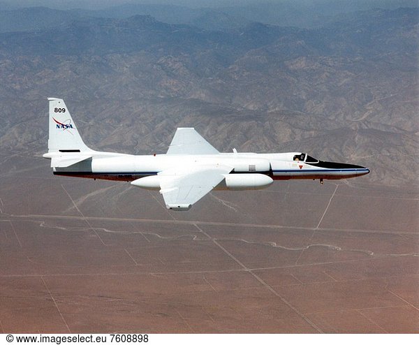 ER_2 tail number 809  is one of two Airborne Science ER_2s used as science platforms by Dryden. The aircraft are platforms for a variety of high_altitude science missions flown over various parts of the world. They are also used for earth science and atmospheric sensor research and development  satellite calibration and data validation. The ER_2s are capable of carrying a maximum payload of 2 600 pounds of experiments in a nose bay  the main equipment bay behind the cockpit  two wing_mounted superpods and small underbody and trailing edges. Most ER_2 missions last about six hours with ranges of about 2 200 nautical miles. The aircraft typically fly at altitudes above 65 000 feet. On November 19  1998  the ER_2 set a world record for medium weight aircraft reaching an altitude of 68 700 feet. The aircraft is 63 feet long  with a wingspan of 104 feet. The top of the vertical tail is 16 feet above ground when the aircraft is on the bicycle_type landing gear. Cruising speeds are 410 knots  or 467 miles per hour  at altitude. A single General Electric F_118 turbofan engine rated at 17 000 pounds thrust powers the ER_2.