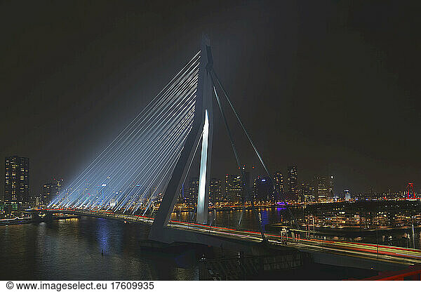Erasmus Bridge (nicknamed The Swan) illuminated at night  crossing the Nieuwe Maas in the center of Rotterdam; Rotterdam  South Holland  Netherlands